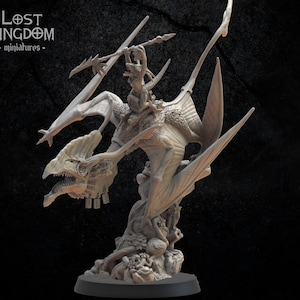 May include: A grey, detailed miniature of a winged creature with a rider holding a spear. The creature has a long, thin neck and a large, open mouth. The rider is wearing armor and a helmet. The miniature is set on a base with a rocky texture.