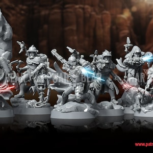 May include: A set of six grey plastic miniature figures of Star Wars characters, standing on circular bases. The figures are posed in action stances, holding weapons and accessories. The text "Assault on Clank Mountain" is visible in the bottom left corner of the image.