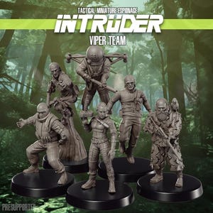 May include: A group of miniature figurines representing a tactical team. The figures are in dynamic poses, with detailed uniforms and weapons. The text "INTRUDER VIPER TEAM" is displayed above. The figurines are mounted on black circular bases.