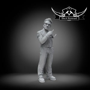May include: A grey figurine of a man in a uniform, holding a pair of glasses. The figure has a stern expression and is standing with one hand in his pocket. The text "Black Remnant" is above the figure.
