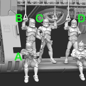 May include: Five grey plastic action figures of clone troopers in a spaceship interior. The figures are holding onto ropes and are positioned in a line. The figures are wearing helmets and armour.