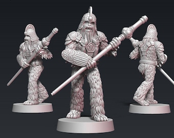 May include: Three gray, detailed miniature figures of Wookiees wearing armor and holding weapons. The figures are posed in different stances and are ready for battle.