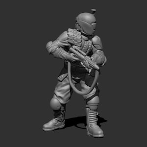 May include: A gray, detailed, 3D printed miniature of a futuristic soldier wearing a helmet and holding a weapon.