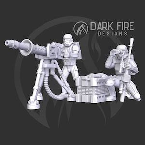 Puede incluir: Un modelo de plástico blanco de un equipo de armas pesadas imperial de Star Wars, con un Stormtrooper operando una ametralladora pesada y otro Stormtrooper con un rifle de francotirador. El equipo está situado cerca de una caja de plástico blanca con una superficie texturizada.