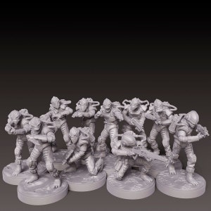 Puede incluir: Un conjunto de diez figuras en miniatura de plástico gris de criaturas humanoides que llevan armadura futurista y sostienen armas. Las figuras están en varias posturas de acción y están de pie sobre bases redondas.
