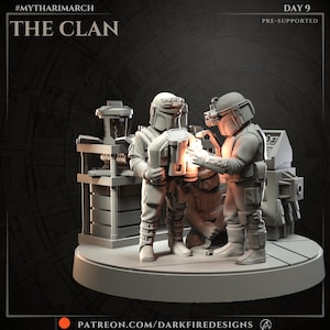 May include: A 3D-printed model depicting three figures in futuristic armor, illuminated by a warm light. The figures are positioned around a piece of equipment. The text "THE CLAN" and "DAY 9" are visible. The model is on a circular base.