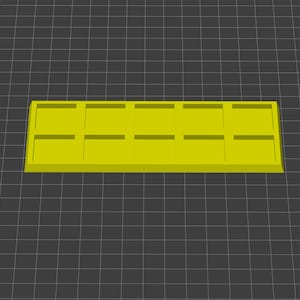 May include: A yellow plastic tray with 12 square compartments.
