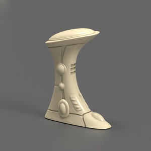 May include: A white, futuristic-looking, ceramic sculpture with a rounded top and a base that resembles a foot. The sculpture has a series of circular and oval shapes along its sides.
