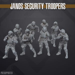 May include: A set of seven grey miniature figures titled JANOS SECURITY TROOPERS. Each figure wears tactical armour, helmets, and gear, posed in various combat stances with weapons drawn. The text PRESUPPORTED is visible at the bottom left.