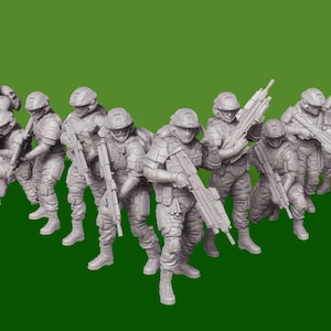 May include: A group of grey plastic miniature figures of soldiers, each holding a rifle, standing in a line formation.