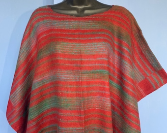 Warm Soft cozy Blanket Poncho in Reds & Greens with a Red fringe. Great for Halloween, autumn and winter