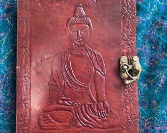 Buddha Notebook Journal. Embossed leather cover, handmade plain paper. 7” tall 4.5” wide 0.75” deep. 18cm x 11.5cm x 2cm