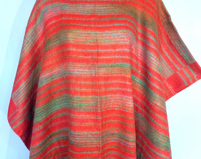 Warm Soft cozy Blanket Poncho in Reds & Greens with a Red fringe. Great for Halloween, autumn and winter