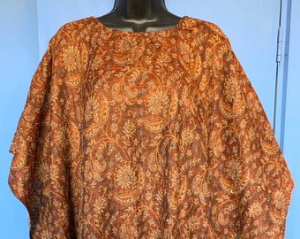 Warm soft cosy Handmade Blanket Poncho in browns oranges & yellows with a mustard fringe. Autumn colours