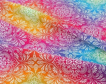 May include: A vibrant fabric with a rainbow gradient, featuring a repeating white floral pattern. The design includes intricate details and a spectrum of colors, from red and orange to purple and blue, creating a visually rich textile.