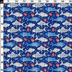 May include: A navy blue fabric with a repeating pattern of white and blue fish, red seashells, and fish bones. The design is a nautical theme, with a whimsical, hand-drawn style. The fabric is suitable for various craft projects.