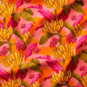 May include: A colourful tropical pattern with yellow bananas, pink leaves, and red flowers set against a pink and orange backdrop. The design displays a repeating pattern of banana bunches and foliage, creating a lively textile design.