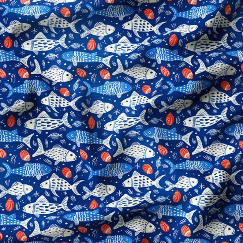 May include: A fabric with a repeating pattern of stylized fish in white and blue against a deep blue background. The design includes small red seashell illustrations and fish bones, creating a nautical theme.