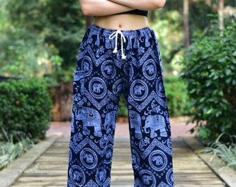 May include: Blue and black printed trousers with an elephant design. The trousers have a drawstring waist and a wide leg.