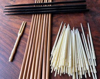 Wood chopsticks, plastic appetizer picks and small appetizer fork.