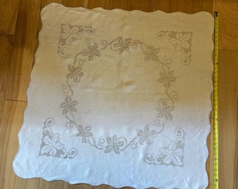 Vintage linen cream 38”  square tablecloth with a lily crossstitch design.