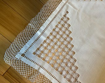 Vintage linen white 35”  square tablecloth with a geometric openwork pattern  and a 2 inch crocheted border.