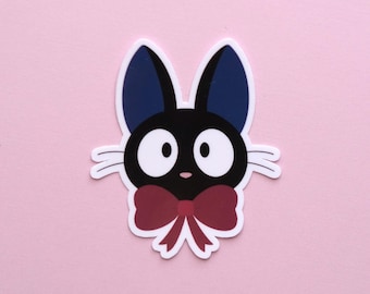 Sticker kat Jiji | Kiki's bezorgservice, rode strik, op ghibli geïnspireerd, dagboek, laptopsticker