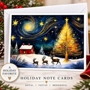 May include: A rectangular holiday note card featuring a starry night sky with a swirling yellow nebula, a glowing golden Christmas tree, a red cabin, and three deer in a snowy landscape. The text reads A HOLIDAY FAVORITE and HOLIDAY NOTE CARDS.