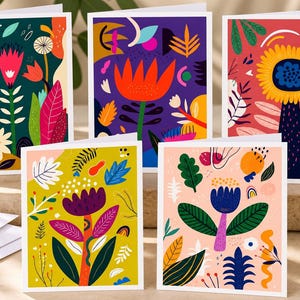 May include: A set of five rectangular greeting cards featuring vibrant, abstract floral illustrations. Each card displays unique botanical patterns in bold colors including deep green, purple, red, yellow, and soft pink, with stylized leaves and flowers.