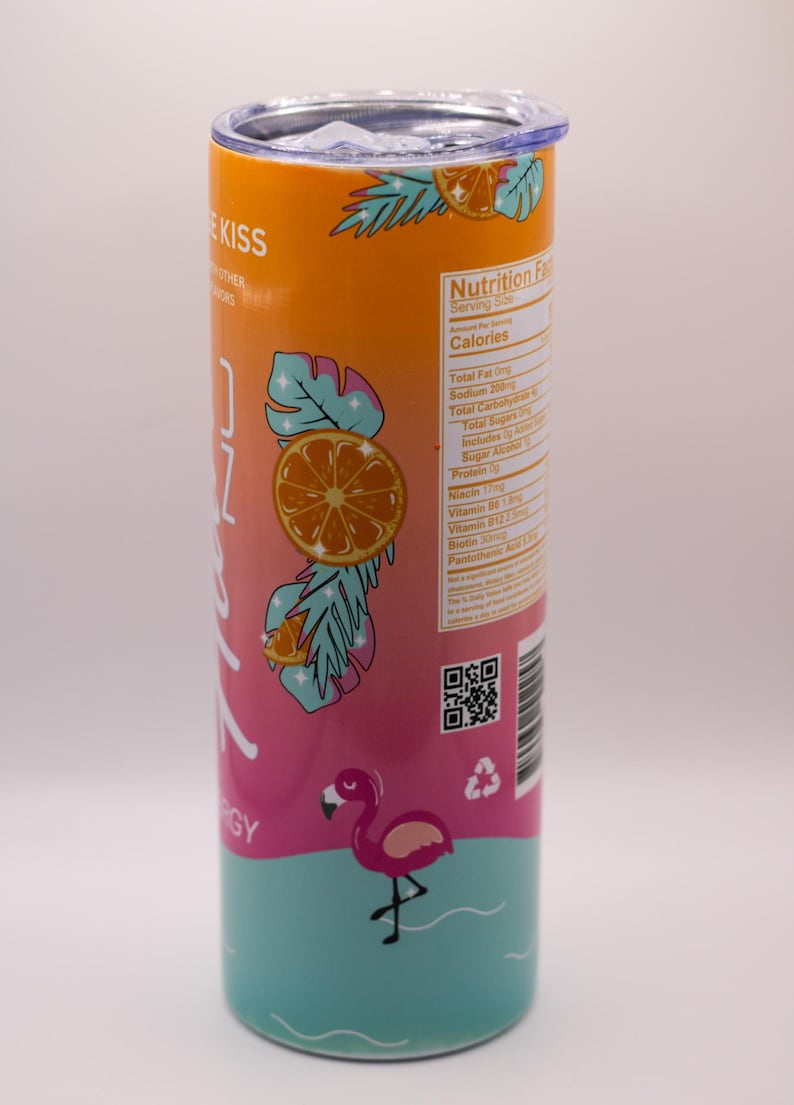 May include: A stainless steel tumbler with a tropical design. The tumbler features a gradient of orange, pink, and teal, with illustrations of oranges, palm leaves, and a flamingo. The text "ZOZ ENERGY" is visible.