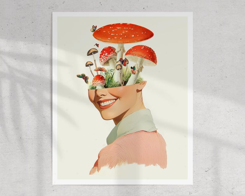 May include: A woman's face is replaced with a cluster of red and white mushrooms growing from a green patch of grass. The mushrooms are arranged in a way that resembles a crown. The woman is smiling and wearing a pink shirt.