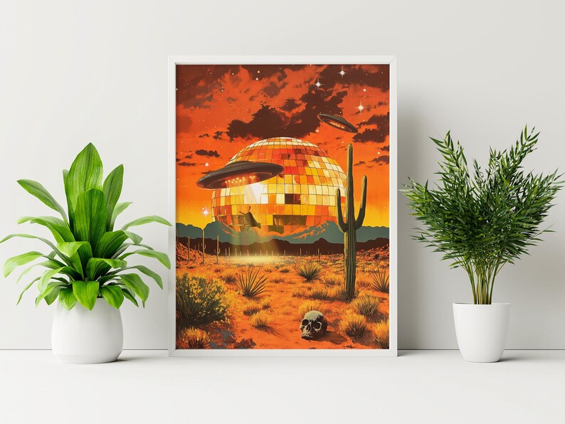 May include: A retro-style illustration of a disco ball in the desert with two flying saucers. The disco ball is surrounded by cacti and a skull.