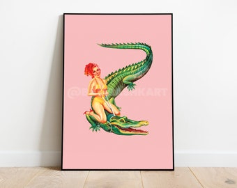 May include: A woman in a red swimsuit sits on a green alligator with a pink background.