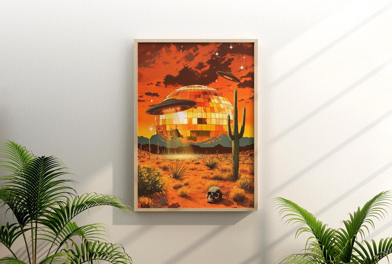 May include: A retro-style illustration of a disco ball in the desert with two flying saucers above it. The sky is orange and the ground is brown. There is a cactus in the foreground and a skull on the ground.