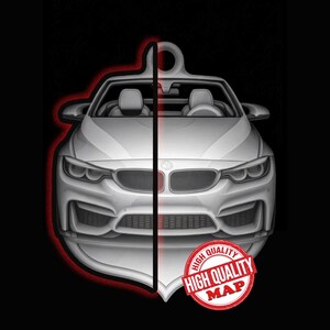 May include: A white convertible car key chain design with a red outline, set against a black background. The key chain features the text "HIGH QUALITY MAP" in a red circle.