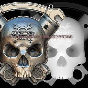 May include: A silver skull with a wrench and piston design, the words "Mechanic" and "www.facebook.com/groups/fiberlaserthenextlevel" are on the skull.