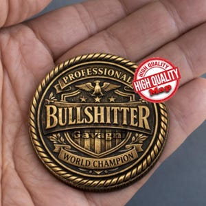 May include: A bronze-coloured coin with the text "PROFESSIONAL BULLSHITTER WORLD CHAMPION" and the name "Gavagni". The coin has a rope-like border and a red "HIGH QUALITY" sticker. The coin is held in a hand.
