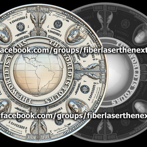 May include: A circular design in silver with the text "The World Is Yours" repeated around the edge. The centre of the design features a globe with the continents of North and South America visible. The design is surrounded by a ring of dollar bills with the text "100" visible on each bill.