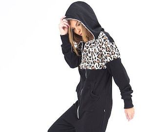 May include: A black hooded jumpsuit with a leopard print panel on the chest. The jumpsuit has a zipper closure and pockets.