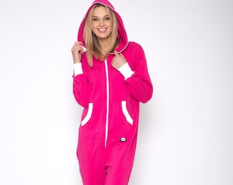 May include: A pink fleece jumpsuit with a white zipper and white trim around the hood. The jumpsuit has two front pockets.