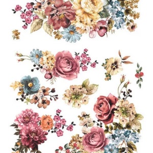 May include: A collection of floral decals featuring a variety of flowers in shades of pink, yellow, blue, and burgundy. The decals include roses, daisies, and other floral arrangements, perfect for crafting or decorating projects.