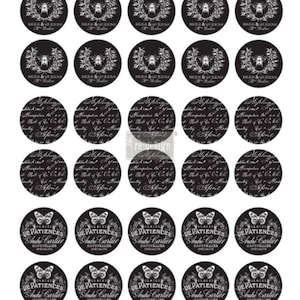 May include: A sheet of black and white round stickers. The stickers feature various designs, including bees, script, and butterflies. Text includes "BEES & QUEENS", "GLACES DE PATIENCES Andre Cartier", and script text. The stickers are for crafts or decoration.