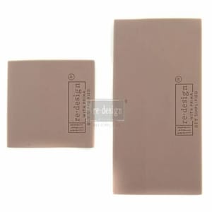 May include: Two rectangular blocks of pink foam with the text "re-design with prima diy simplified" printed on them.