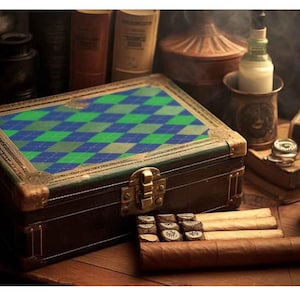May include: A vintage-style cigar humidor with a green and blue argyle pattern on the lid. The humidor is brown with gold-colored accents and a clasp. Several cigars and a small glass of liquid are visible.