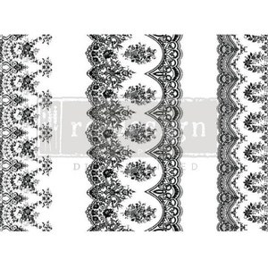 May include: Three black and white lace patterns on a white background. The patterns are vertical and feature intricate designs.