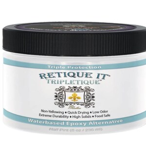 May include: A clear plastic jar with a black lid containing a white liquid. The jar is labeled "Triple Protection RETIQUE IT TRIPLETIQUE" and "Waterbased Epoxy Alternative Half Pint (8 oz / 236 ml)".