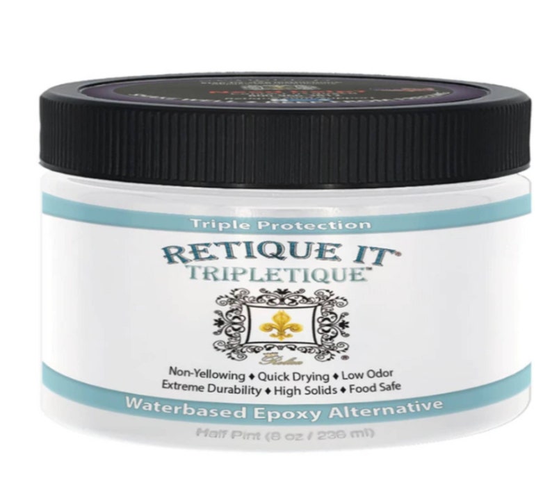 May include: A clear plastic jar with a black lid containing a white liquid. The jar is labeled "Triple Protection RETIQUE IT TRIPLETIQUE" and "Waterbased Epoxy Alternative Half Pint (8 oz / 236 ml)".