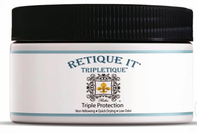 May include: White jar with a black lid labeled "Retique It Tripletique" with a gold crest and the text "Triple Protection Non-Yellowing &bull; Quick Drying &bull; Low Odor"