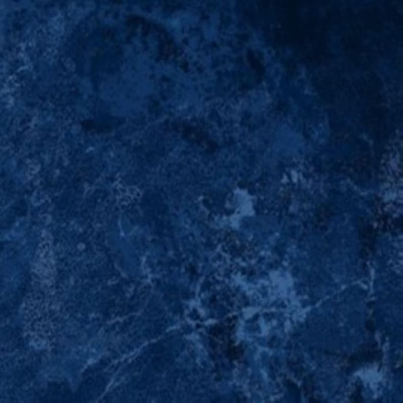 May include: A dark blue textured background with a marbled effect.