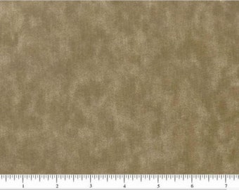 May include: Close-up of a textured fabric in shades of tan and beige. The fabric has a mottled appearance with subtle variations in color, creating a vintage or distressed look. A ruler is at the bottom, showing inches.